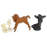 A terracotta foal, H20cm, an angel, a musician, a glass bird, and an Art Deco style lustre figure