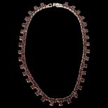 A sterling silver and garnet set fringe necklace, length 44cm