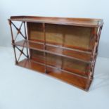 A 19th century mahogany concave fronted hanging shelf. 92x57x23cm.