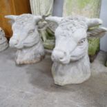 A pair of concrete bull head gatepost caps. 47x50x44cm.