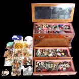 A tray of costume brooches, necklaces, and a jewellery box and a large quantity of costume jewellery