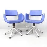 A pair of contemporary Welonda swivel Barber's chairs, each on chrome base with rise and fall