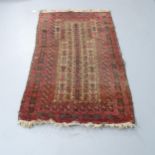A red-ground Persian prayer rug. 150x90cm. Worn and faded.
