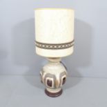 A mid-century West German pottery lamp with original shade. Height overall 84cm.