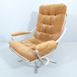A mid-century design chrome and upholstered swivel lounge chair in the manner of Geoffrey