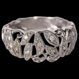 A delicate 9ct white gold and diamond set dress ring, with openwork decoration, size R