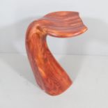 A 1980s whale tail flukes barstool of sculpted laminated wood block construction, in the manner of