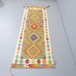 A Chobi Kilim runner. 210x64cm.