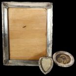 A rectangular silver-fronted photo frame, a heart-shaped silver-fronted photo frame, and a
