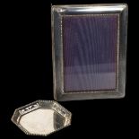 A modern silver-fronted rectangular photo frame, and a small octagonal silver dish (2)