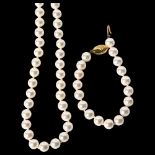 A string of Isle of Wight Prestige pearls with 9ct gold clasp, overall length 62cm, and a matching