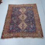An antique blue-ground Persian rug. 185x160cm