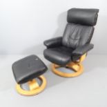An Ekornes style black faux leather upholstered reclining swivel lounge chair, with matching