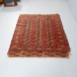 An antique red-ground Afghan rug. 142x125cm.