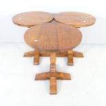 A set of three oak circular lamp / occasional tables. 46x57cm.