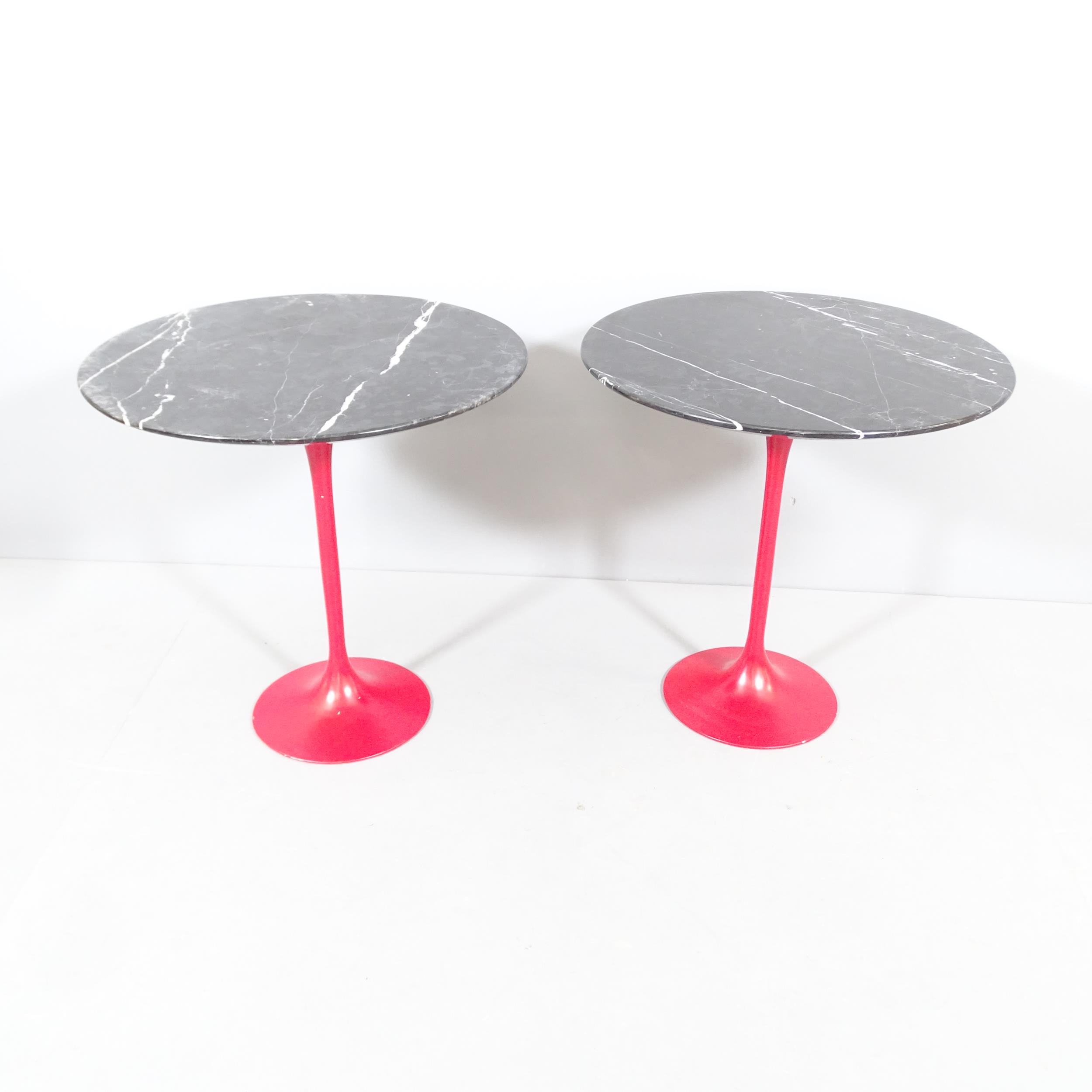 A pair of marble topped tulip occasional tables on painted metal bases, in the manner of Eero