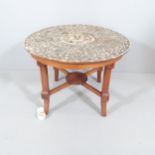 An antique circular mother-of-pearl and bone inlaid centre table on modern mahogany base. 85x61. A/