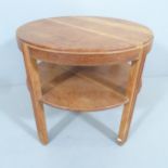 A 1930s Art Deco design circular oak coffee table, in the manner of Heals. 60x55cm.