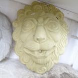A concrete lion wall mask, height 54cm. pierced for use as a water feature.