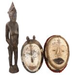 2 African Tribal carved and painted wood masks, length 36cm, and a carved wood standing fertility