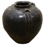 A large Burmese treacle glaze pottery jar, with shoulder ring handles, height 55cm 1 shoulder handle