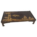 A Japanese lacquer bed tray, with gilded and lacquer bamboo and landscape scene, 65 x 35cm A split