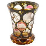 A 19th century Bohemian amber flashed glass spa beaker, with engraved points of interest