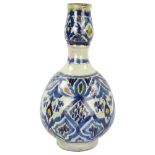 A 19th century Moroccan Islamic pottery double-gourd vase, with painted decoration, height 33cm A