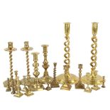 A collection of brass candlesticks, including a pair of open twist, height 30cm
