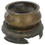 A Chinese patinated bronze incense burner, dog of fo handles, on separate bronze stand, rim diameter