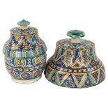 A Moroccan Islamic pottery jar and cover, with painted decoration, height 28cm, and a large Moroccan