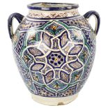 A large Moroccan Islamic pottery 2-handled jar, with hand painted geometric designs, height 36cm A