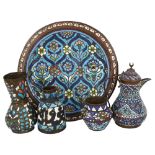 A group of Islamic metalware with enamel decoration, including a charger, diameter 38cm, a wine