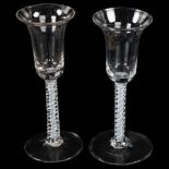 2 similar 18th century cordial glasses with milk twist stems, height 17cm 1 glass has a tiny rim