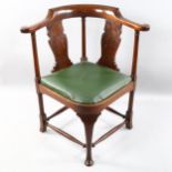 A late 19th century mahogany corner chair, by Heal & Son, with carved splat, Heal label under
