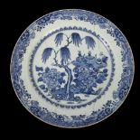 An 18th century Chinese blue and white vessels charger, diameter 35cm, A/F Charger has been broken