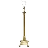 A Victorian brass Corinthian column standard lamp, converted to electric, height to top of column