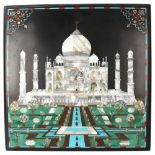 An Indian slate plaque with inlaid mother-of-pearl turquoise and gemstone set study of the Taj