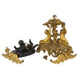A 19th century gilt-bronze table centre supported by cherubs, height 25cm, pair of gilt-bronze
