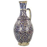A large Moroccan Islamic pottery wine ewer, height 50cm Paint is rubbed on the edges of the
