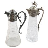 2 cut-glass Claret jugs with silver plated mounts, 1 with lion shield finial, 32cm Good condition,