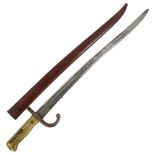 A 19th century French brass-hilted sword bayonet with metal scabbard