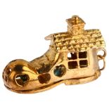 A mid-20th century 9ct gold shoe house fairytale kinetic charm/pendant, opening to reveal enamel