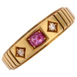 A Victorian 18ct gold three stone ruby and diamond ring, maker's marks WGM, Birmingham 1881, setting