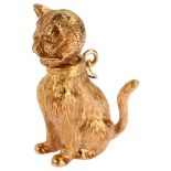 A heavy late 20th century 9ct rose gold articulated seated cat charm/pendant, maker's mark R Co,