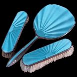 A George V Art Deco silver and teal enamel 3-piece dressing table set, comprising hand mirror and