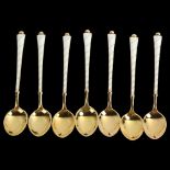 EGON LAURIDSEN - a set of 7 Danish vermeil sterling silver and white enamel coffee spoons, length