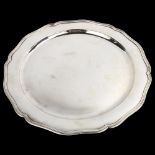 A large Portuguese silver serving platter, plain circular form with scalloped rim, eagle hallmark