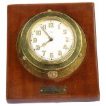 J W BENSON - an early 20th century brass ship's nautical timepiece, white enamel dial with Arabic