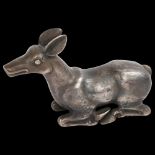 An Indian white metal model recumbent doe, probably 18th or 19th century, length 10cm, 5.3oz No